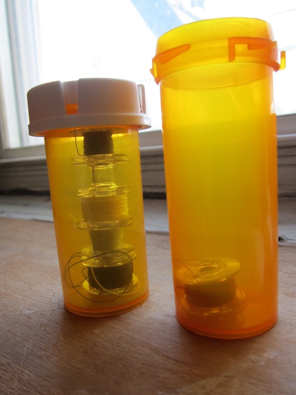 Organization Tip: Pill Bottle Bobbin Storage | Red-Handled Scissors